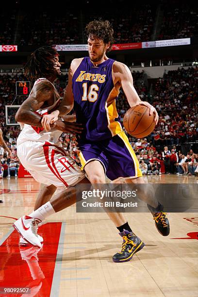 Pau Gasol of the Los Angeles Lakers drives the ball past Jared Jeffries of the Houston Rockets on March 27, 2010 at the Toyota Center in Houston,...