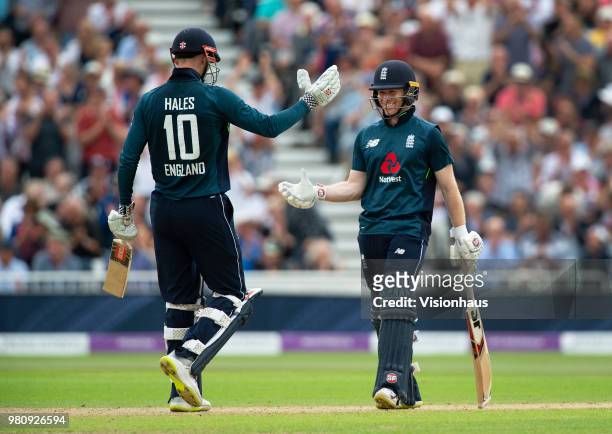 Eoin Morgan of England and Alex Hales celebrate the team beating the all time highest ODI score during the 3rd Royal London ODI match between England...