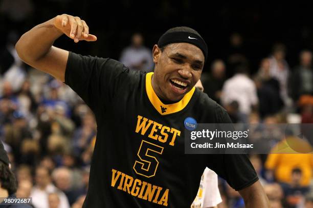 Kevin Jones of the West Virginia Mountaineers celebrates after West Virginia won 73-66 against the Kentucky Wildcats during the east regional final...