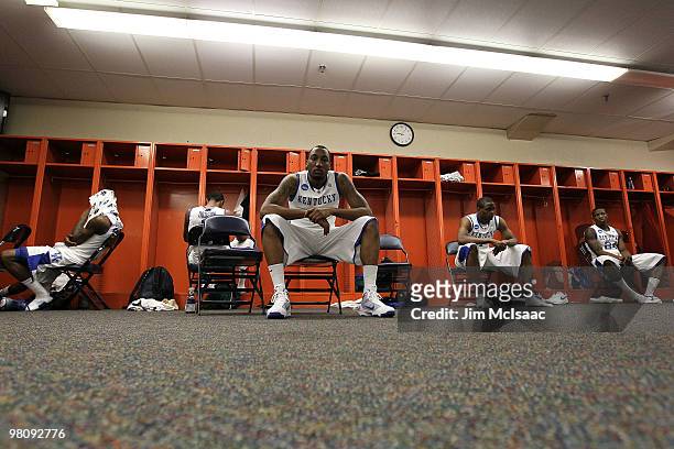 DeAndre Liggins, Darnell Dodson, Ramon Harris, Darius Miller and Eric Bledsoe of the Kentucky Wildcats sit in the locker room dejected after they...