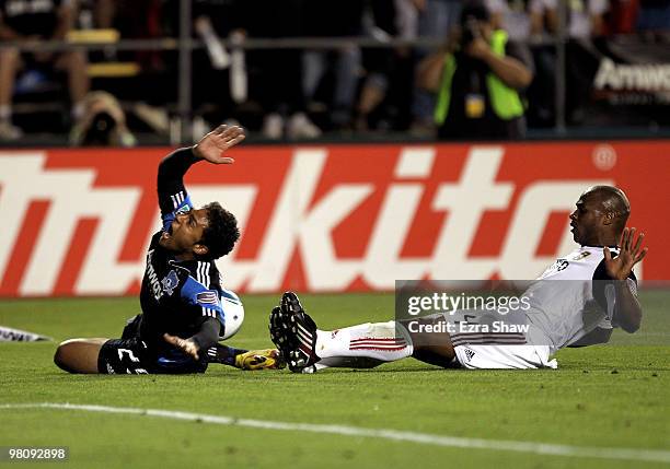 Jamison Olave of Real Salt Lake tackles Quincy Amarikwa of the San Jose Earthquakes at Buck Shaw Stadium on March 27, 2010 in Santa Clara, California.