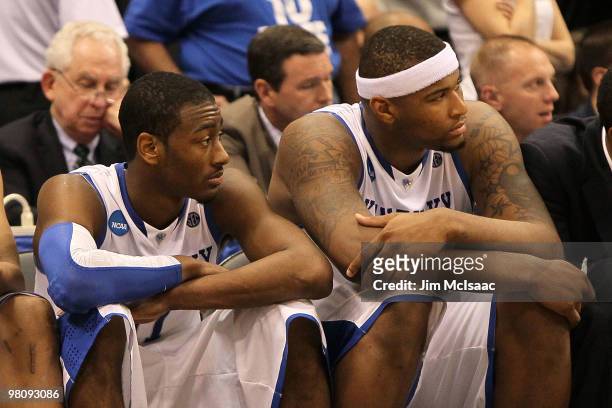 John Wall and DeMarcus Cousins of the Kentucky Wildcats sit on the bench dejected in the final minutes of the second half against the West Virginia...