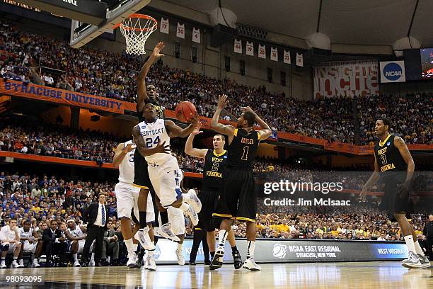 Eric Bledsoe of the Kentucky Wildcats drives for a shot attempt against the West Virginia Mountaineers during the east regional final of the 2010...