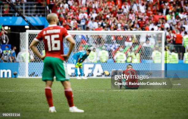 Romain Saiss, Monir El Kajoui and Faycal Fajr of Morroco look dejected after losing the 2018 FIFA World Cup Russia group B match between Portugal and...