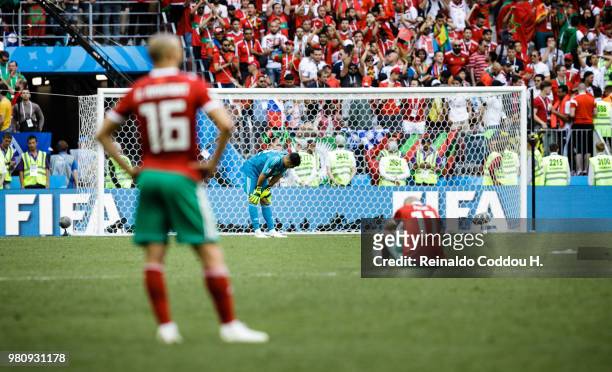 Romain Saiss, Monir El Kajoui and Faycal Fajr of Morroco look dejected after losing the 2018 FIFA World Cup Russia group B match between Portugal and...