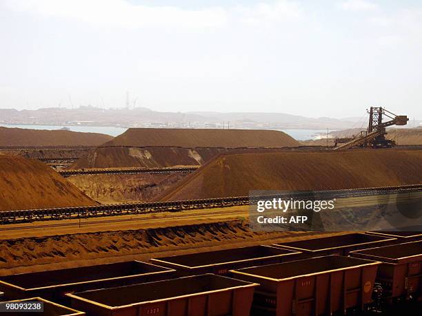 Technology-Australia-Britain-mining-RioTinto, by Amy Coopes This photo taken on March 4, 2010 shows rail cars waiting to be stacked with iron ore at...