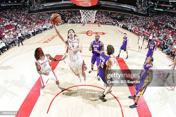 Luis Scola of the Houston Rockets shoots the ball over Pau Gasol of the Los Angeles Lakers on March 27, 2010 at the Toyota Center in Houston, Texas....