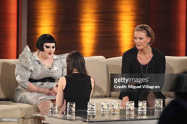 Singer Lena Meyer-Landrut sits on her knees in front of singer Beth Ditto during the 188th 'Wetten dass ...?' show at Messezentrum Salzburg on March...