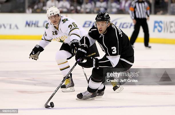 Jack Johnson of the Los Angeles Kings is pursued by Jere Lehtinen of the Dallas Stars in the first period at Staples Center on March 27, 2010 in Los...