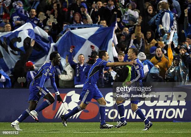 Kei Kamara and Davy Arnaud of the Kansas City Wizards celebrate with Jack Jewsbury after Jewsbury scored during the game against D.C United on March...