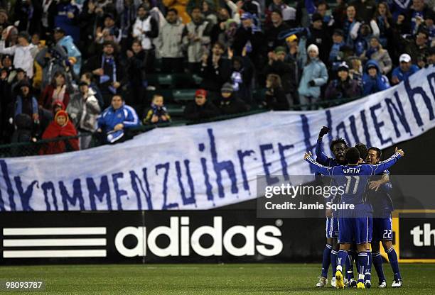 Ryan Smith, Kei Kamara and Davy Arnaud of the Kansas City Wizards celebrate with Jack Jewsbury after Jewsbury scored during the game against D.C...