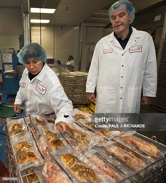 Cuisine Solutions CEO Stanislas Vilgrain watches production workers on March 23 in Alexandria, Virginia, during food prepaprations. Cusine Solutions...
