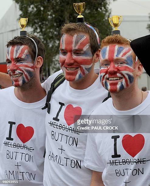 Fans of British McLaren drivers Jensen Button and Lewis Hamilton prepare for Formula One's Australian Grand Prix in Melboune on March 28, 2010. AFP...