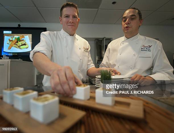 Cuisine Solutions Sous Chef Peter Coffey and Executive Chef Bruno Bertin prepare a meal at the corporate presentation kitchen on March 23, 2010 in...