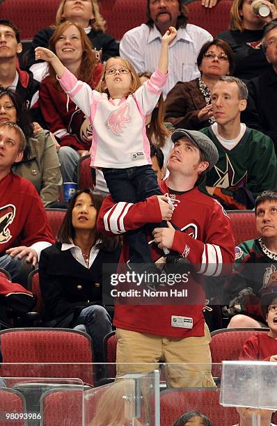 Young Phoenix Coyotes fan cheers for her team as they take on the Colorado Avalanche on March 27, 2010 at Jobing.com Arena in Glendale, Arizona.