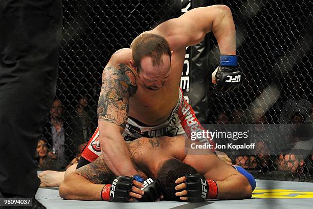 Fighter Shane Carwin battles against Frank Mir during their "Interim" Heavyweight title bout at UFC 111 at the Prudential Center on March 27, 2010 in...