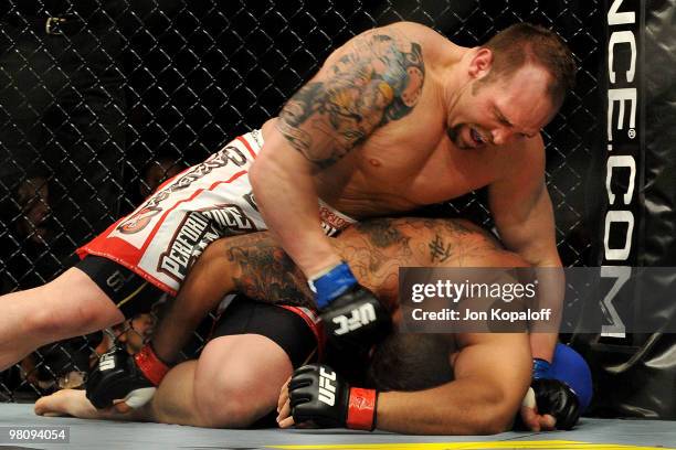 Fighter Shane Carwin battles against Frank Mir during their "Interim" Heavyweight title bout at UFC 111 at the Prudential Center on March 27, 2010 in...