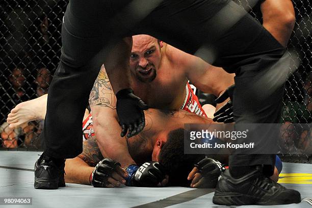 Fighter Shane Carwin defeats Frank Mir as the referee ends the match during their "Interim" Heavyweight title bout at UFC 111 at the Prudential...