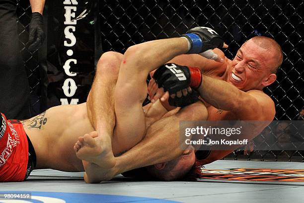 Fighter Georges St-Pierre battles Dan Hardy during their Welterweight title bout at UFC 111 at the Prudential Center on March 27, 2010 in Newark, New...