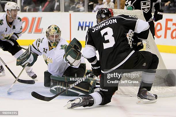 Goaltender Kari Lehtonen of the Dallas Stars makes a save on Jack Johnson of the Los Angeles Kings in the second period at Staples Center on March...