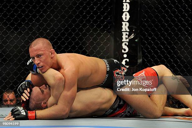 Fighter Georges St-Pierre battles Dan Hardy during their Welterweight title bout at UFC 111 at the Prudential Center on March 27, 2010 in Newark, New...