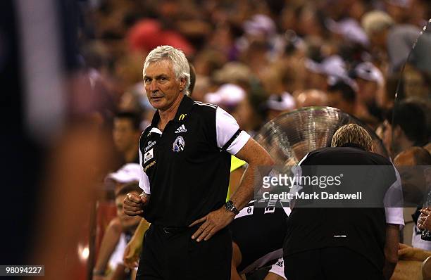 Mick Malthouse coach of the Magpies looks on from the Interchange bench during the round one AFL match between the Western Bulldogs and the...