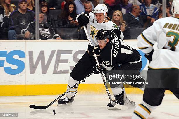 Nicklas Grossman of the Dallas Stars battles for the puck against Brad Richardson of the Los Angeles Kings on March 27, 2010 at Staples Center in Los...