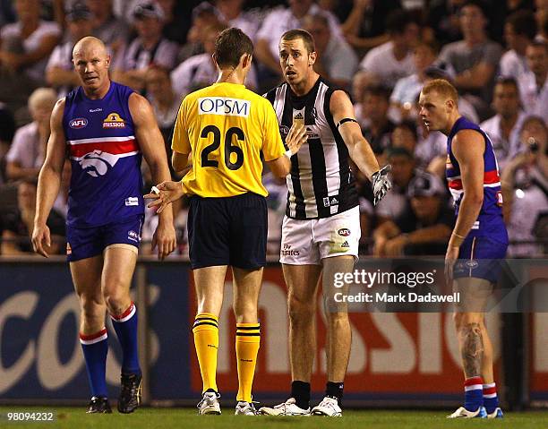 Nick Maxwell of the Magpies questions an umpire about a decision which cost the Magpies a goal during the round one AFL match between the Western...