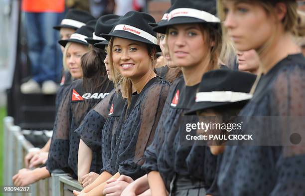 Australian models relax before the start of Formula One's Australian Grand Prix in Melboune on March 28, 2010. AFP PHOTO/Paul CROCK