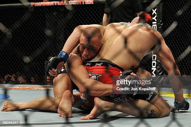 Fighter Georges St-Pierre battles Dan Hardy during their Welterweight title bout at UFC 111 at the Prudential Center on March 27, 2010 in Newark, New...