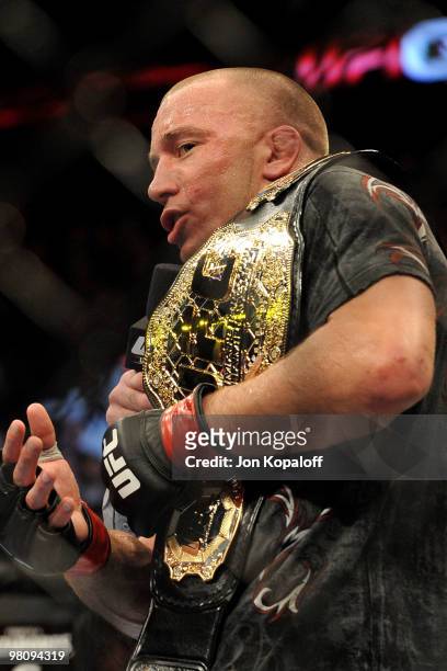 Fighter Georges St-Pierre holds the belt after defeating Dan Hardy during their Welterweight title bout at UFC 111 at the Prudential Center on March...
