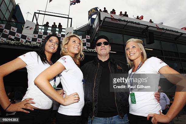 Actor John Travolta is seen on the grid before the Australian Formula One Grand Prix at the Albert Park Circuit on March 28, 2010 in Melbourne,...