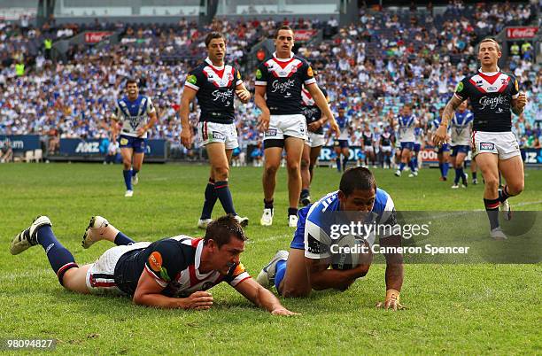 Ben Barba of the Bulldogs scores a try during the round three NRL match between the Canterbury Bulldogs and the Sydney Roosters at ANZ Stadium on...