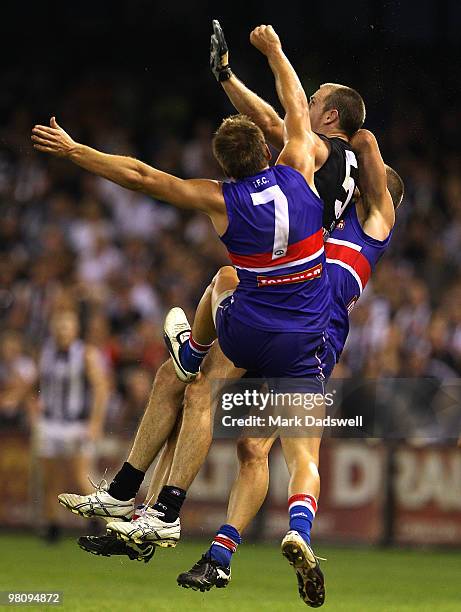 Shaun Higgins of the Bulldogs competes with Nick Maxwell of the Magpies during the round one AFL match between the Western Bulldogs and the...