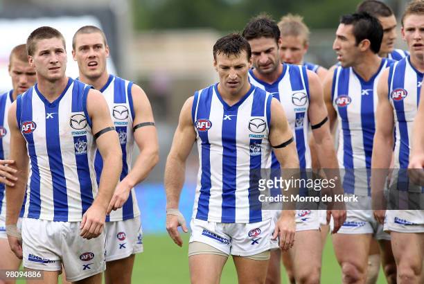 Captain Brent Harvey of the Kangaroos leads his team from the field after losing the round one AFL match between the Port Adelaide Power and the...