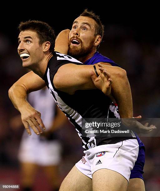 Darren Jolly of the Magpies contests a boundary throw in with Ben Hudson of the Bulldogs during the round one AFL match between the Western Bulldogs...