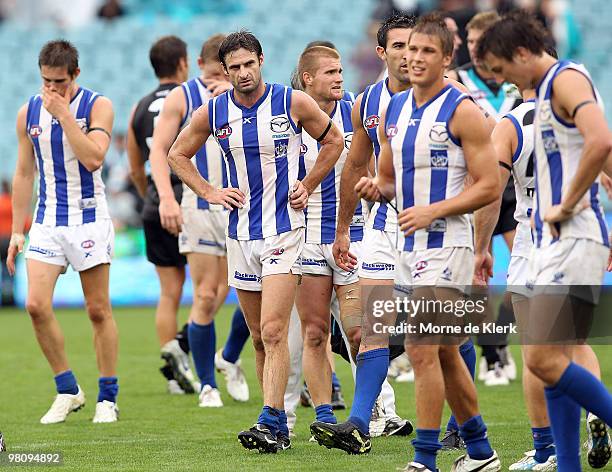 North Melbourne players leave the field after losing the game in the round one AFL match between the Port Adelaide Power and the North Melbourne...