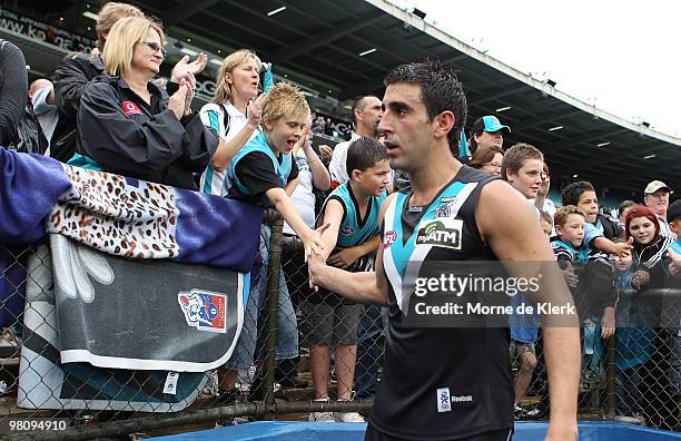 Captain Domenic Cassisi of the Power leaves the field after winning the round one AFL match between the Port Adelaide Power and the North Melbourne...