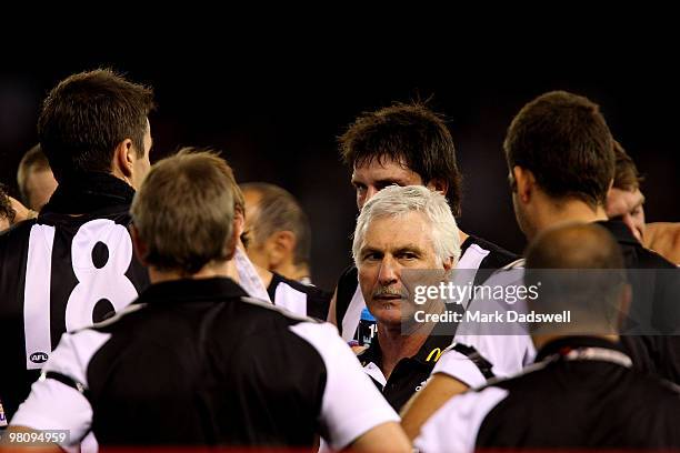 Mick Malthouse coach of the Magpies addresses his team during the round one AFL match between the Western Bulldogs and the Collingwood Magpies at...