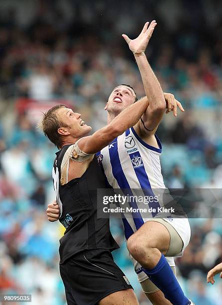 Dean Brogan of the Power competes with Todd Goldstein of the Kangaroos during the round one AFL match between the Port Adelaide Power and the North...