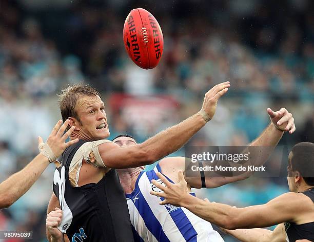 Dean Brogan of the Power competes with Todd Goldstein of the Kangaroos during the round one AFL match between the Port Adelaide Power and the North...