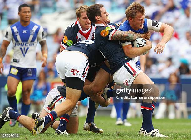 David Stagg of the Bulldogs is tackled by Nate Myles of the Roosters during the round three NRL match between the Canterbury Bulldogs and the Sydney...