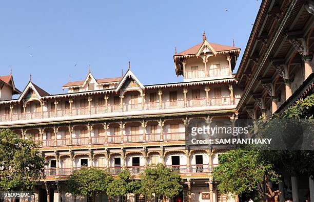 Four-storied haveli stands beside The Kalupur Swaminarayan Temple in Ahmedabad on March 5 where the citys Heritage Walk starts. Ancient monuments and...