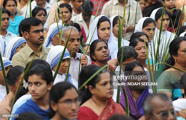Indian Catholic Christians participate in a Palm Sunday procession at the Saint Mary's Church in Secunderabad, the twin city of Hyderabad, on March...
