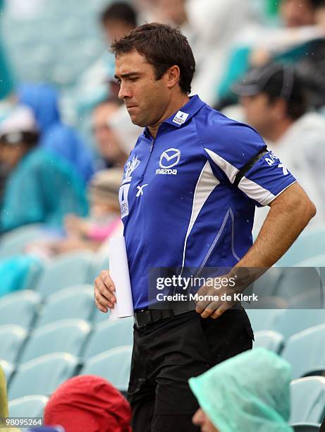 Coach Brad Scott of the Kangaroos comes onto the field at the three quarter time break during the round one AFL match between the Port Adelaide Power...