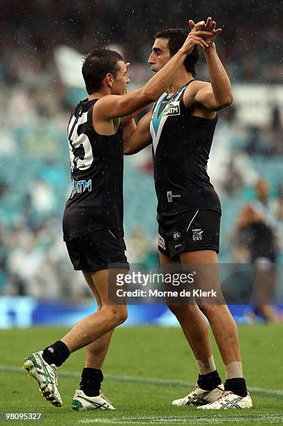 Cameron Hitchcock and Domenic Cassisi of the Power celebrate a goal during the round one AFL match between the Port Adelaide Power and the North...