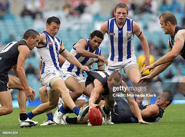 Mitchell Banner of the Power dives for the ball during the round one AFL match between the Port Adelaide Power and the North Melbourne Kangaroos at...