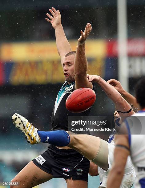 Jacob Surjan of the Power flies through the air during the round one AFL match between the Port Adelaide Power and the North Melbourne Kangaroos at...