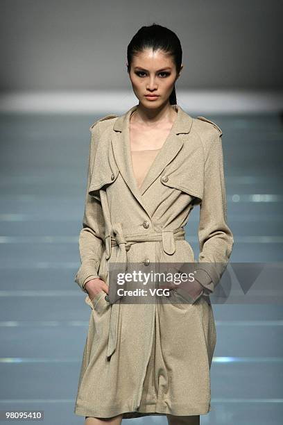 Model walks on the runway in the collection show of Snow Lotus ZOU You as part of the China Fashion Week A/W on March 27, 2010 in Beijing, China.