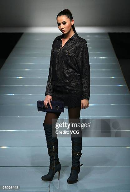 Model walks on the runway in the collection show of Snow Lotus ZOU You as part of the China Fashion Week A/W on March 27, 2010 in Beijing, China.